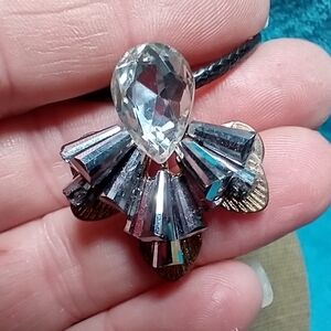 Goldtone abstract crystal grey necklace